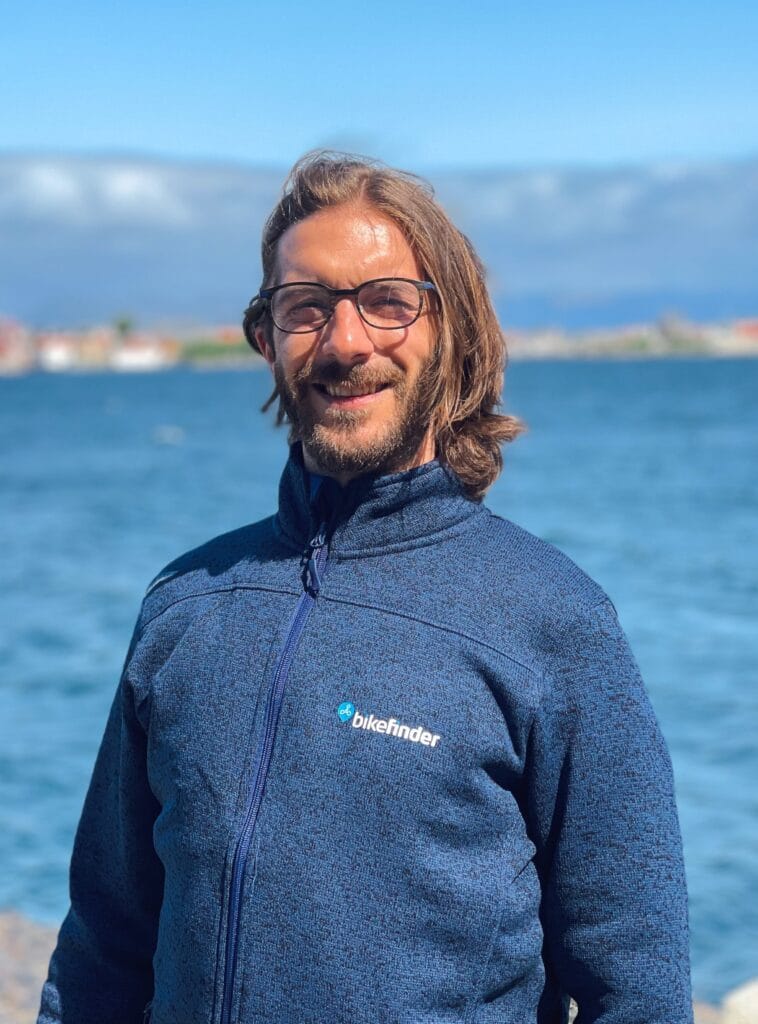 picture of Kenneth standing in front of the sea 